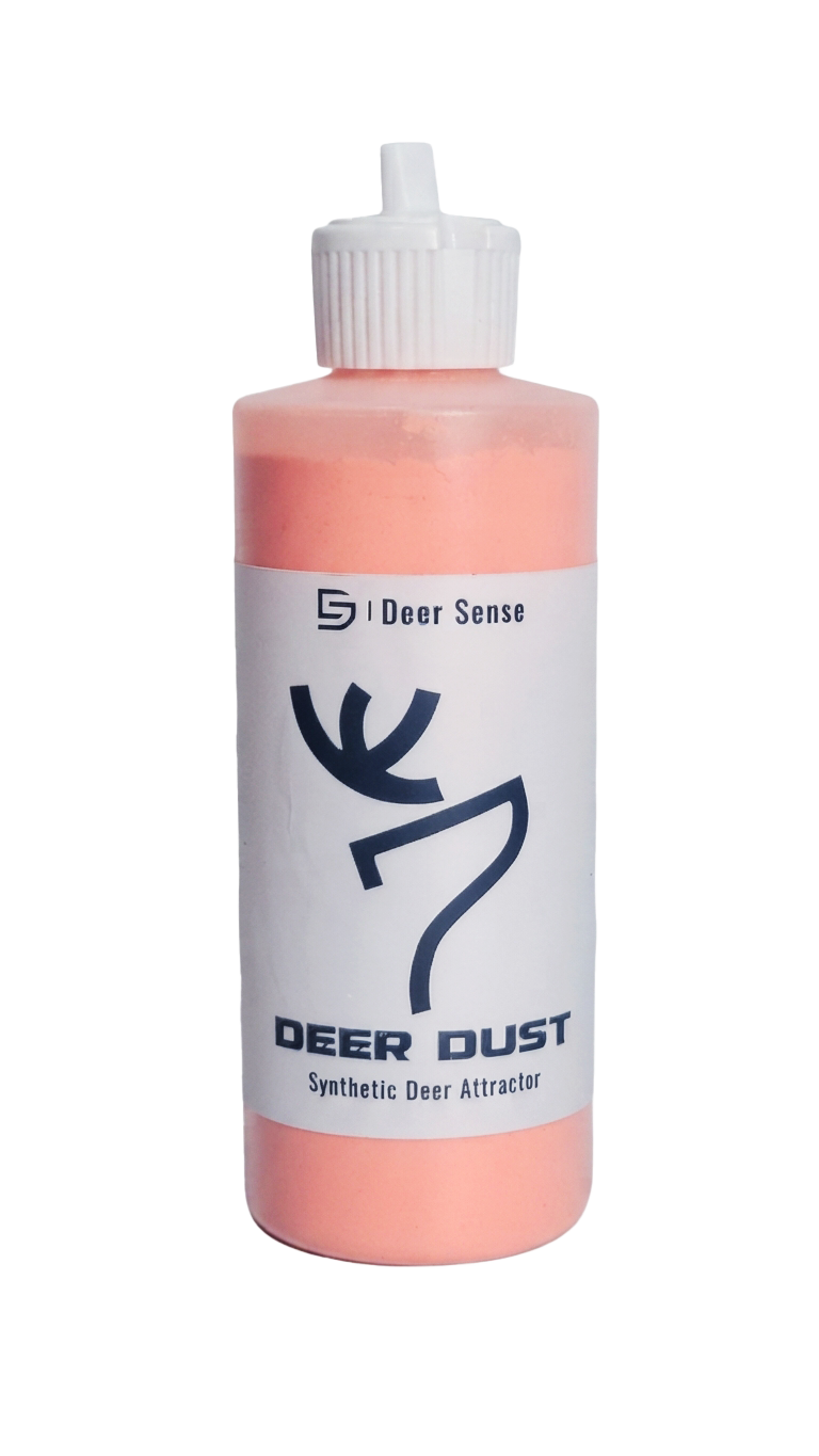 A bottle of Deer Dust Synthetic Deer Attractor by Deer Sense, featuring a white label with a black deer graphic and a white cap, containing a orange-colored powder.