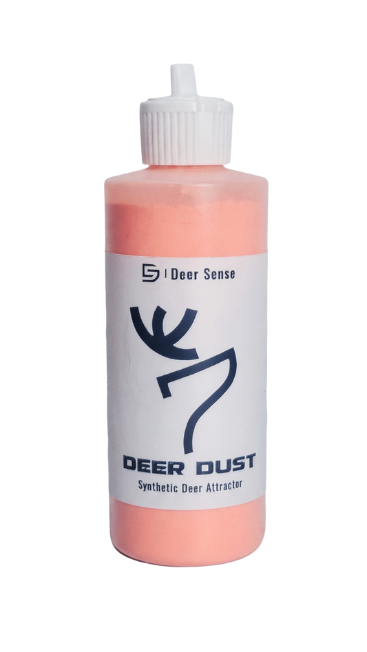 A bottle of Deer Dust Synthetic Deer Attractor by Deer Sense, featuring a white label with a black deer graphic and a white cap, containing a orange-colored powder.